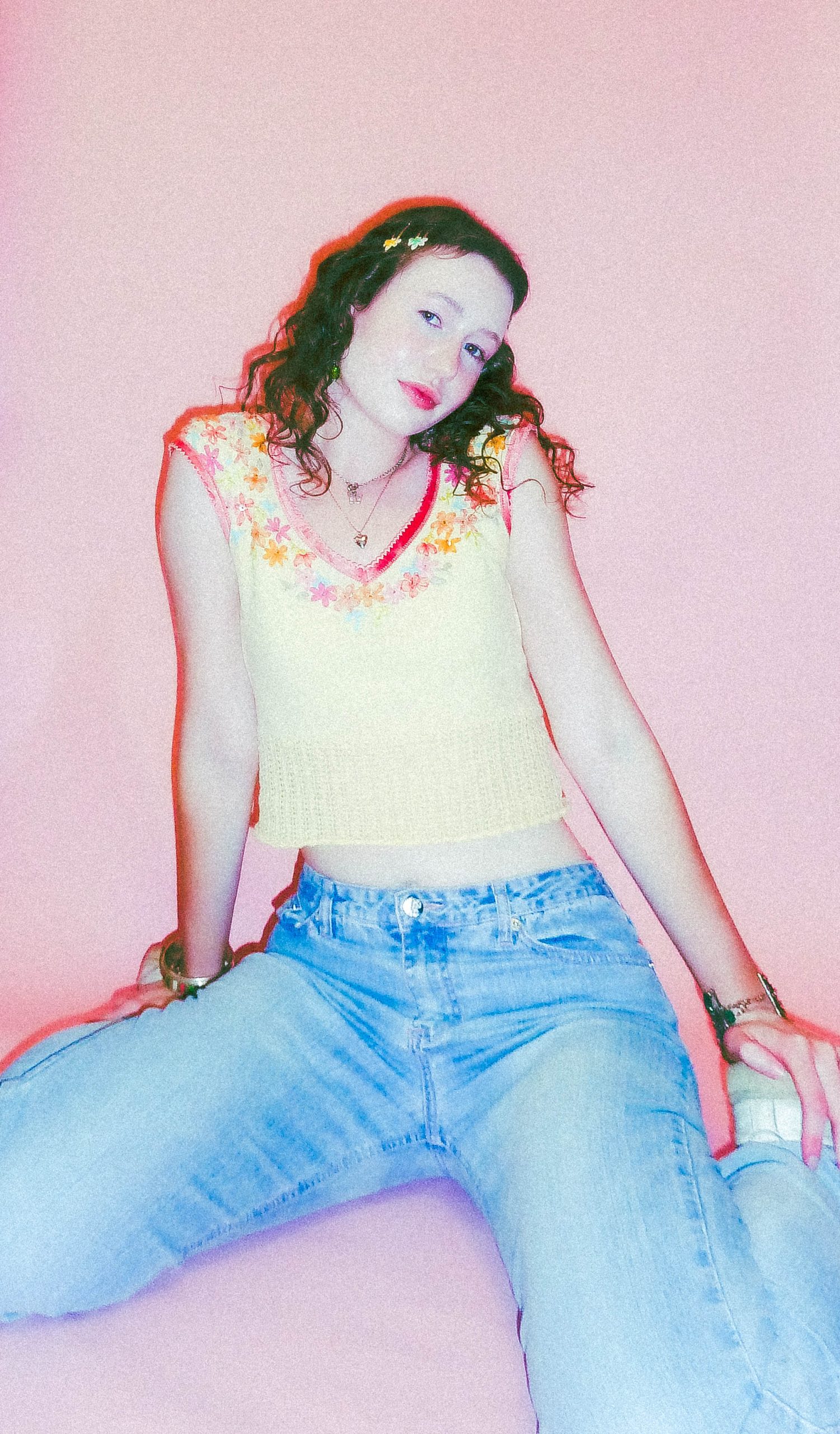 model squat posing with pink background
