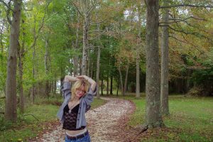 model dancing around the trees