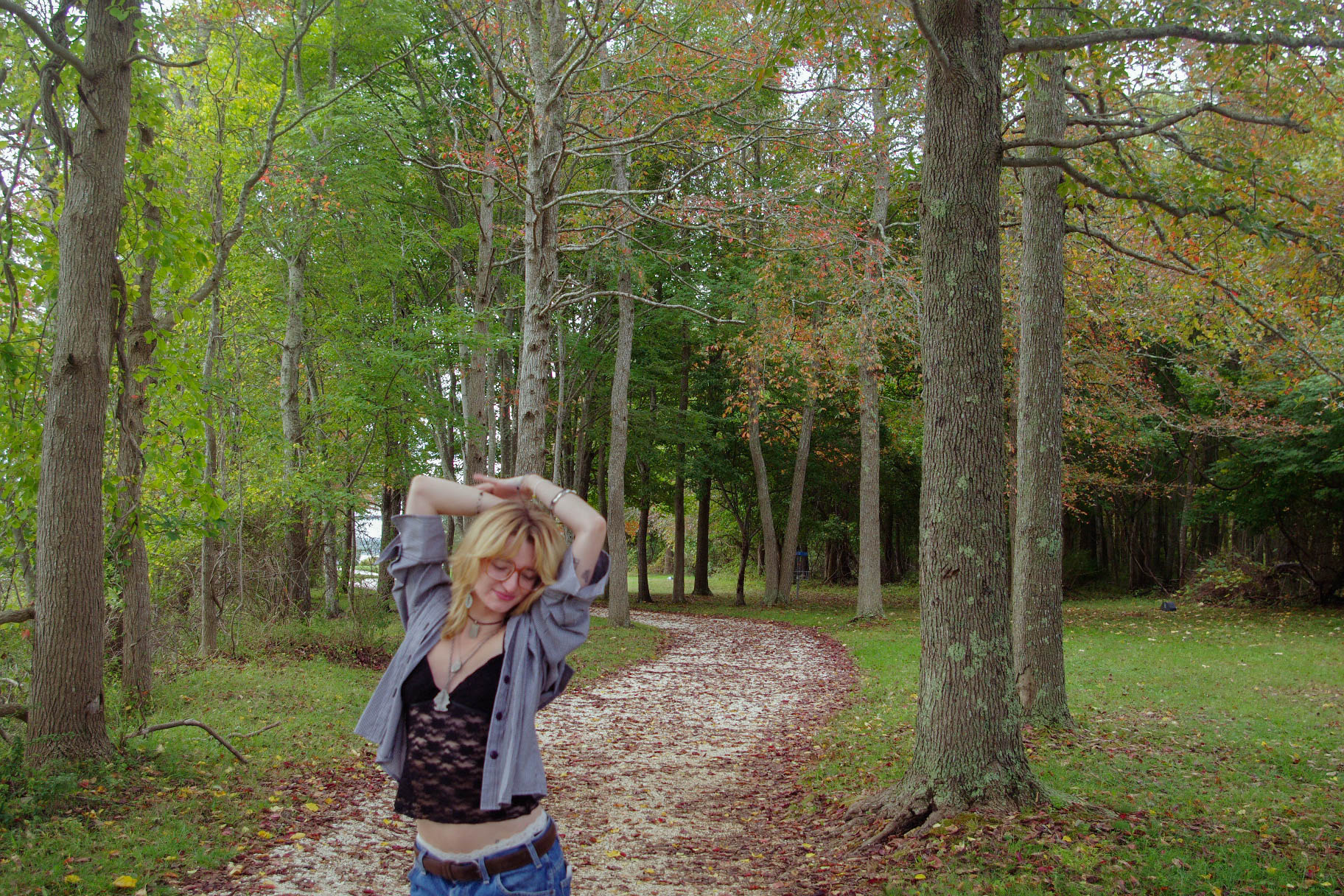 model dancing around the trees