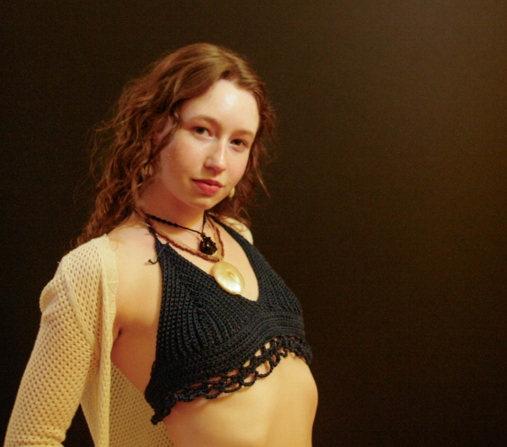 model wearing handmade crochet piece