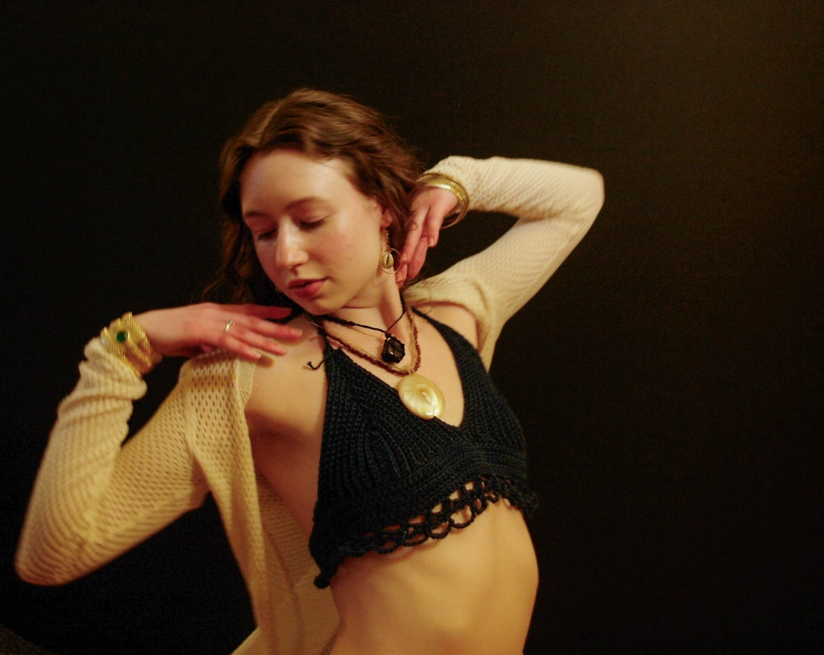 model wearing handmade crochet piece