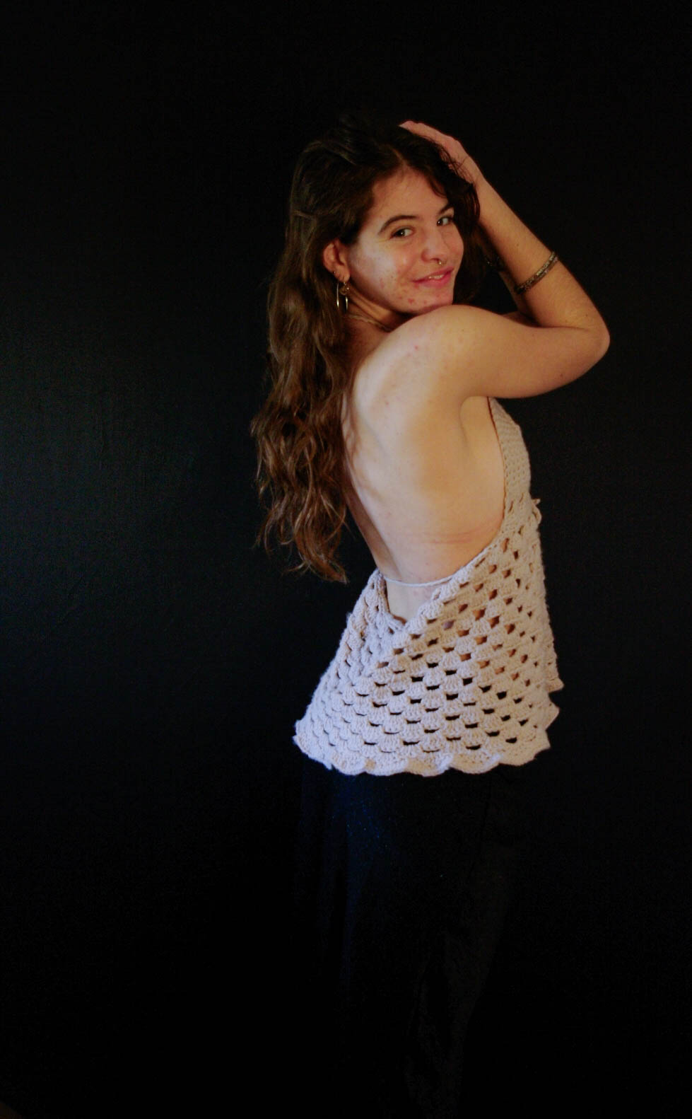model wearing handmade crochet piece
