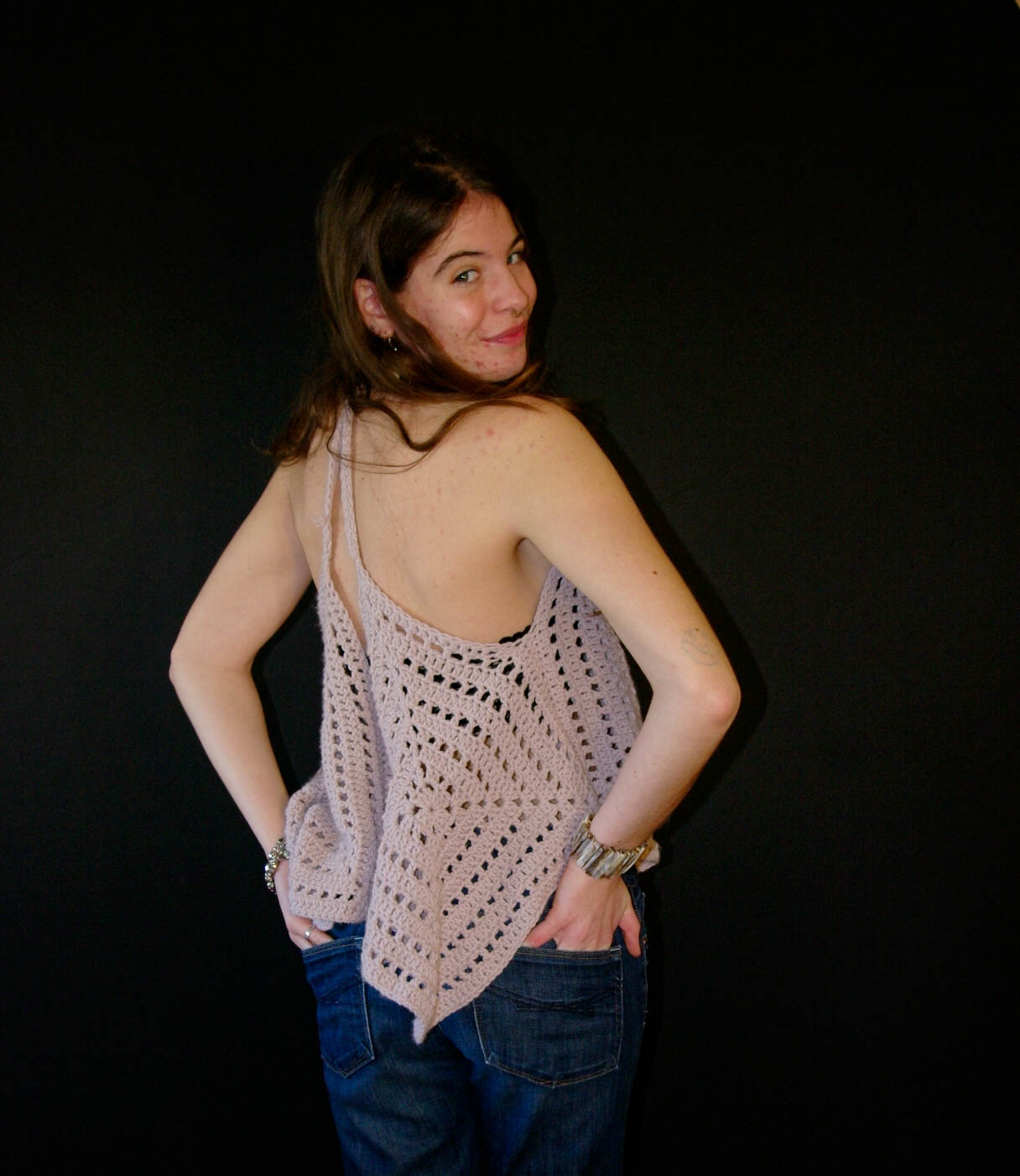 model wearing handmade crochet piece