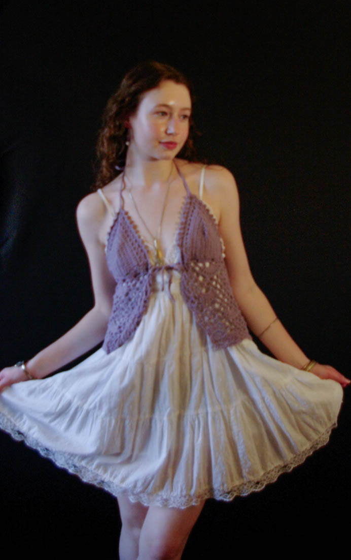 model wearing handmade crochet piece