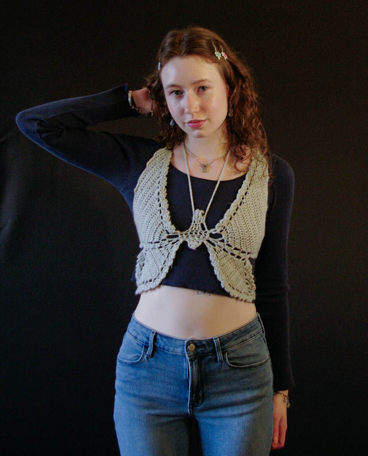 model wearing handmade crochet piece