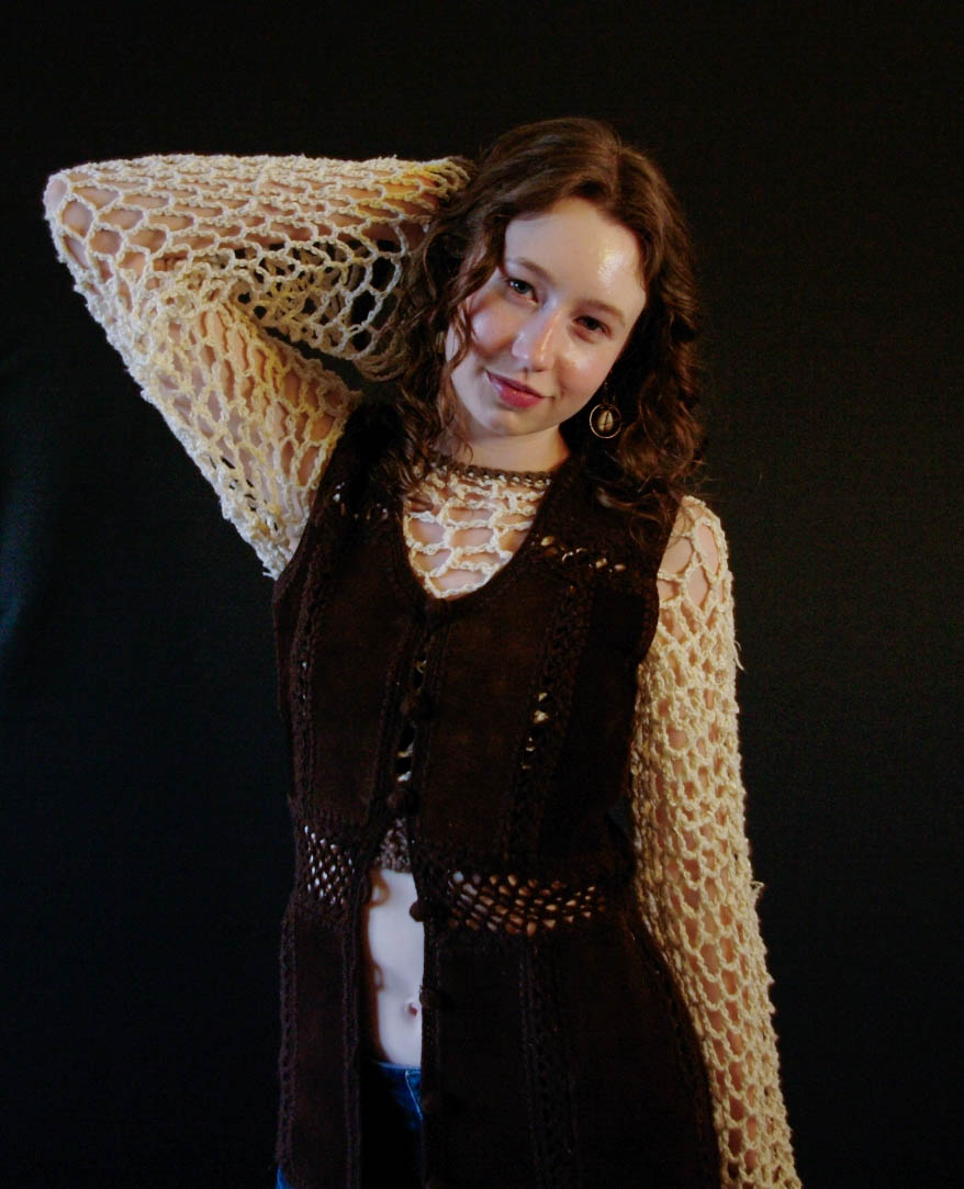 model wearing handmade crochet piece