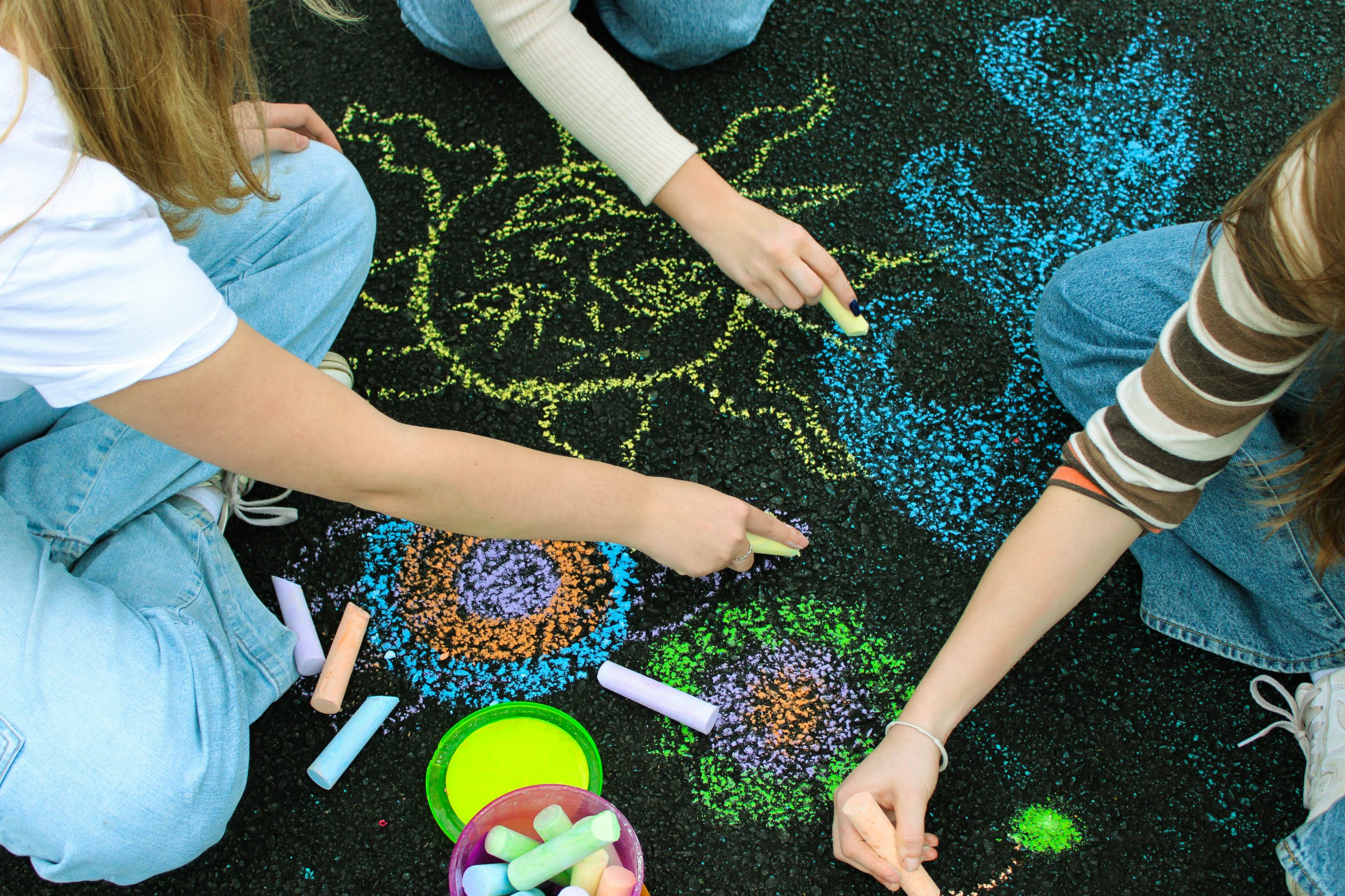 3 models playing with chalk