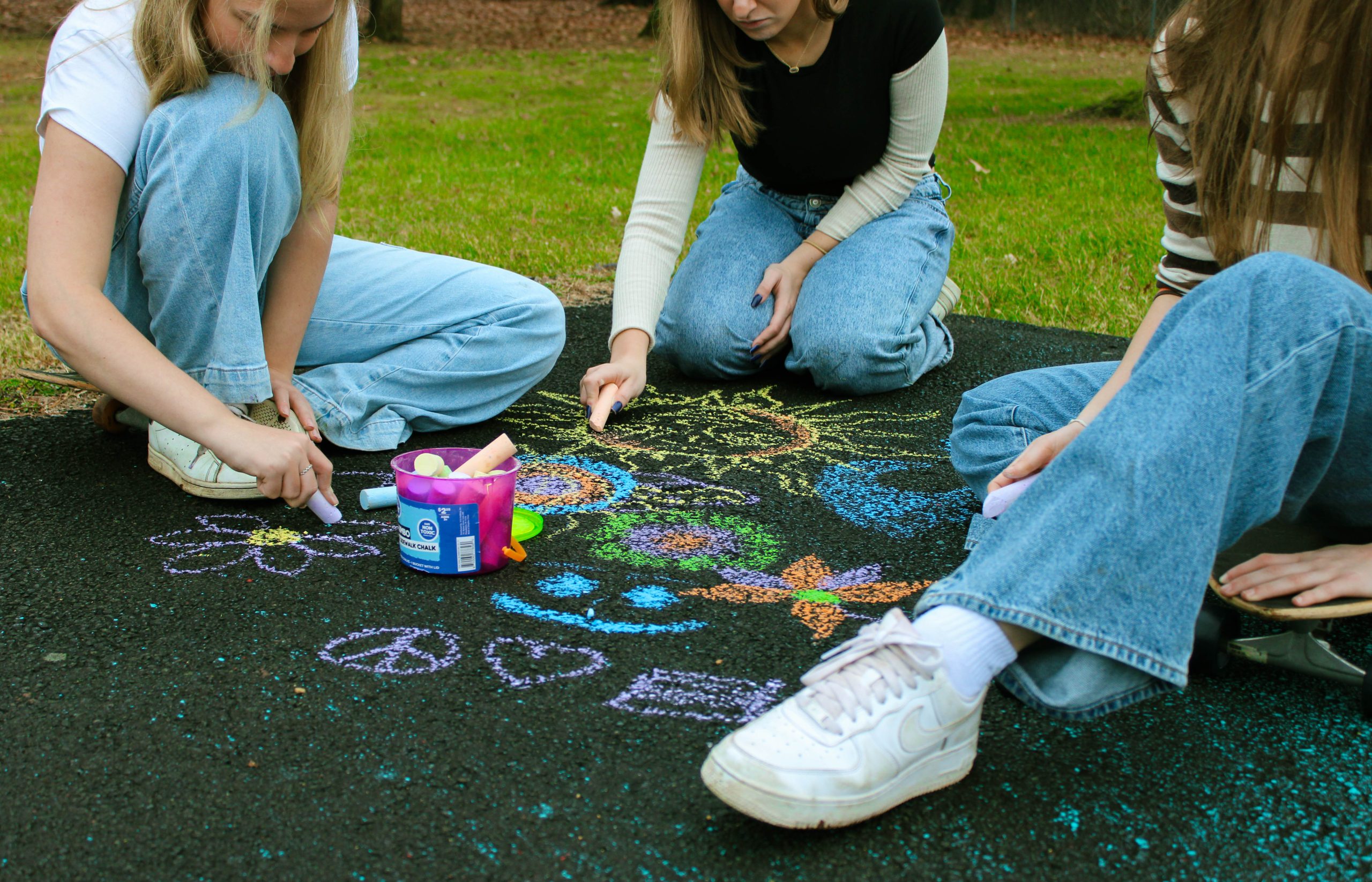3 models playing with chalk