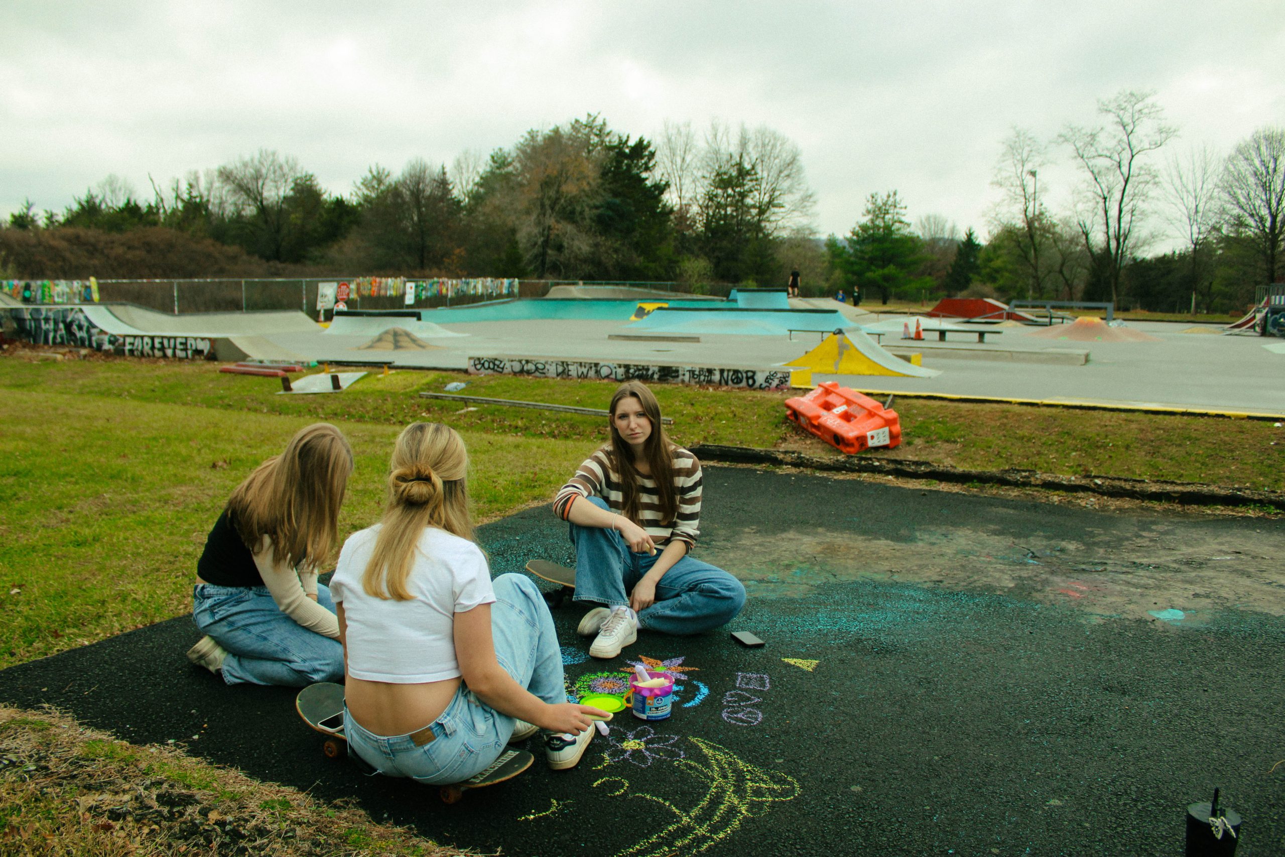 3 models playing with chalk