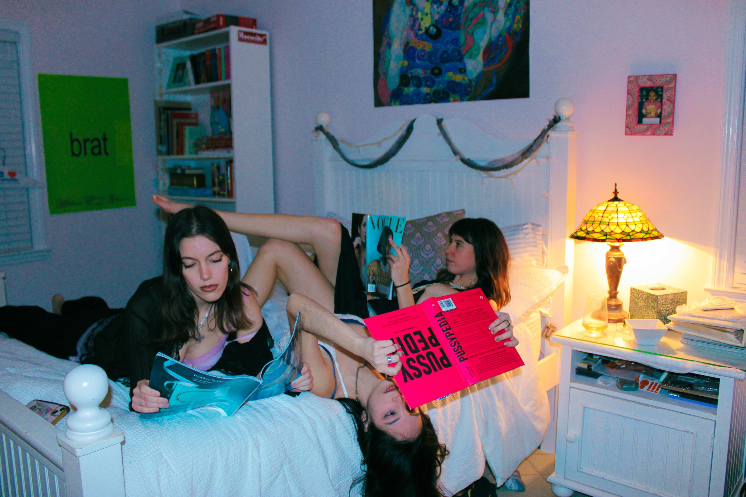 3 model reading on the bed