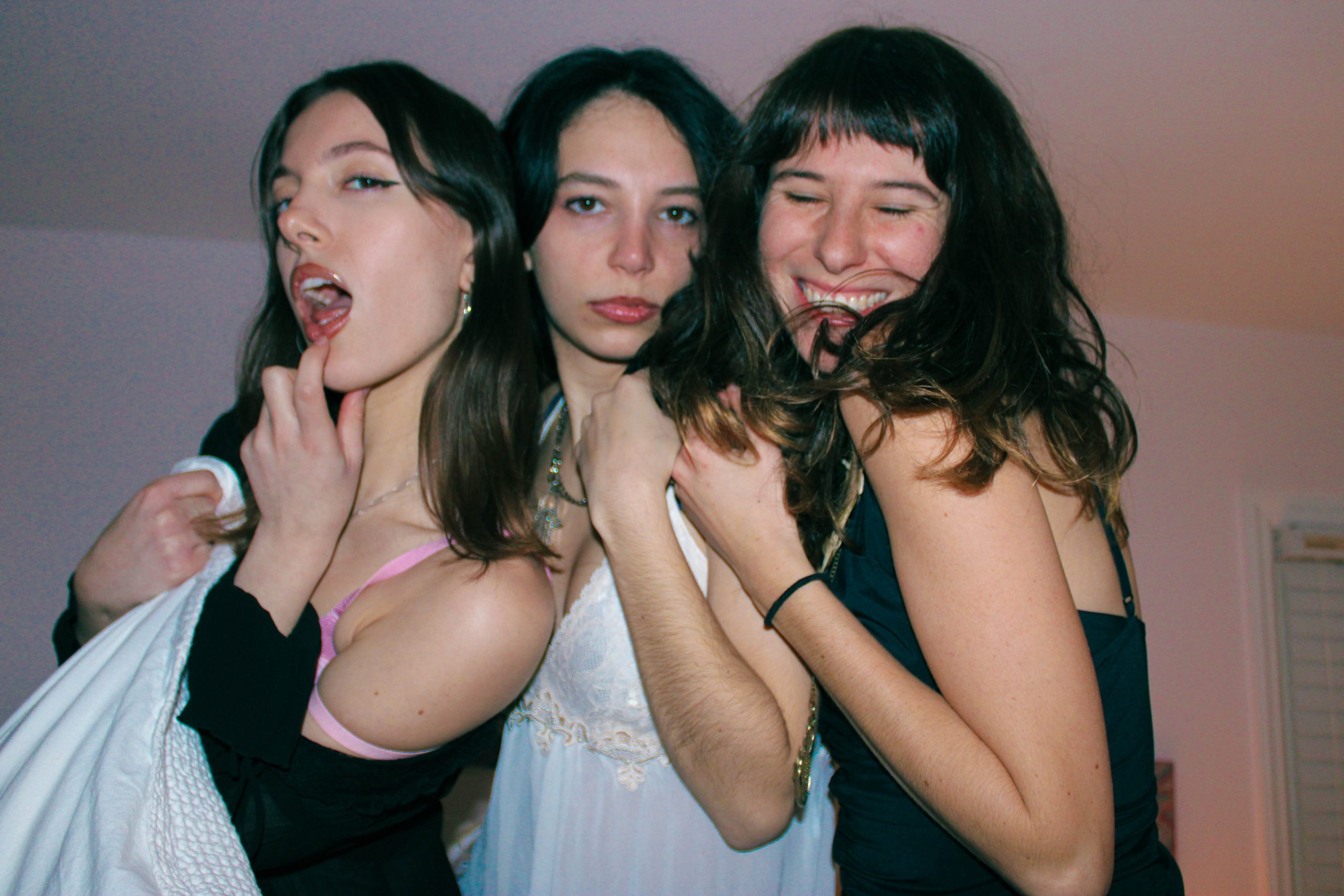 3 models smiling at the camera
