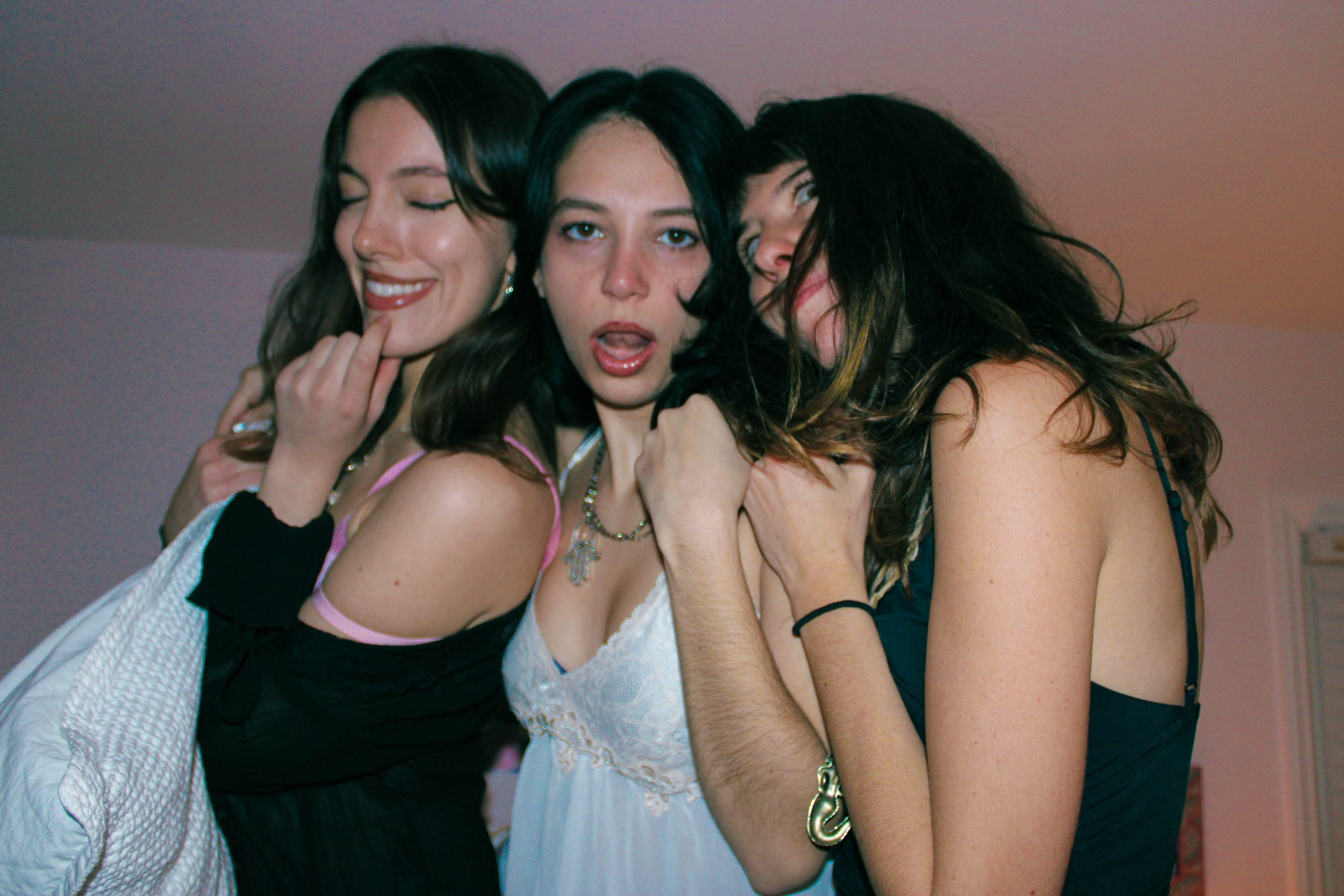 3 models smiling at the camera